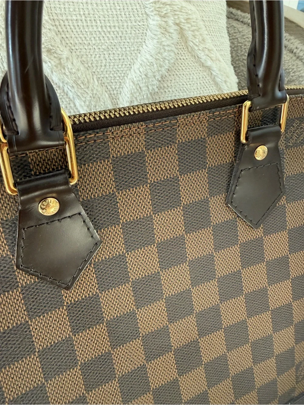 Louis Vuitton imperfections lock